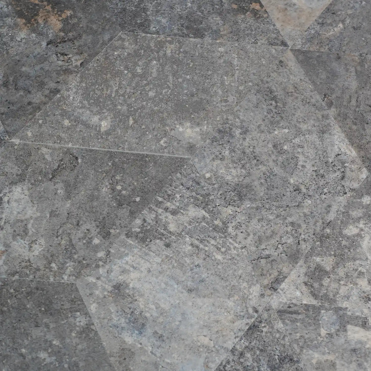 Close-up of peel and stick diamond gray stone tiles with a geometric pattern
